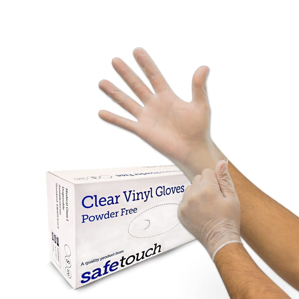 Safetouch clear vinyl gloves, powder free, food safe - box of 100 with gloved hands